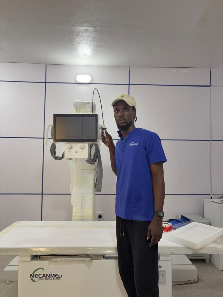 A local service engineer completes on-site installation of radiology equipment from a medical supplier for Africa.