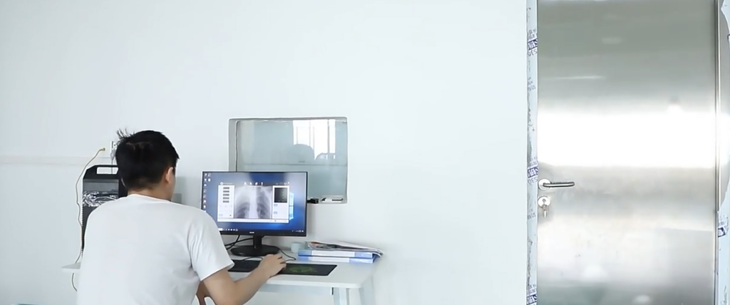 An expert technician tests diagnostic imaging software at a reliable medical equipment factory in China.