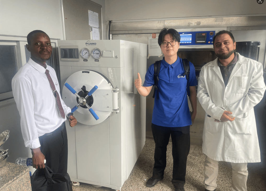 A high-temperature sterilizer autoclave inspected during a follow-up field visit to a medical clinic in Zambia.
